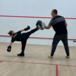 Young boy focusing on his sparring at his 121 session with Master Vice