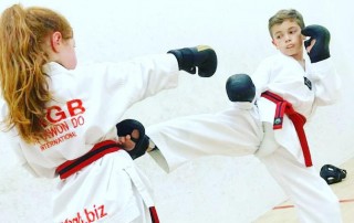 Girl and Boy sparring Sefton Taekwondo